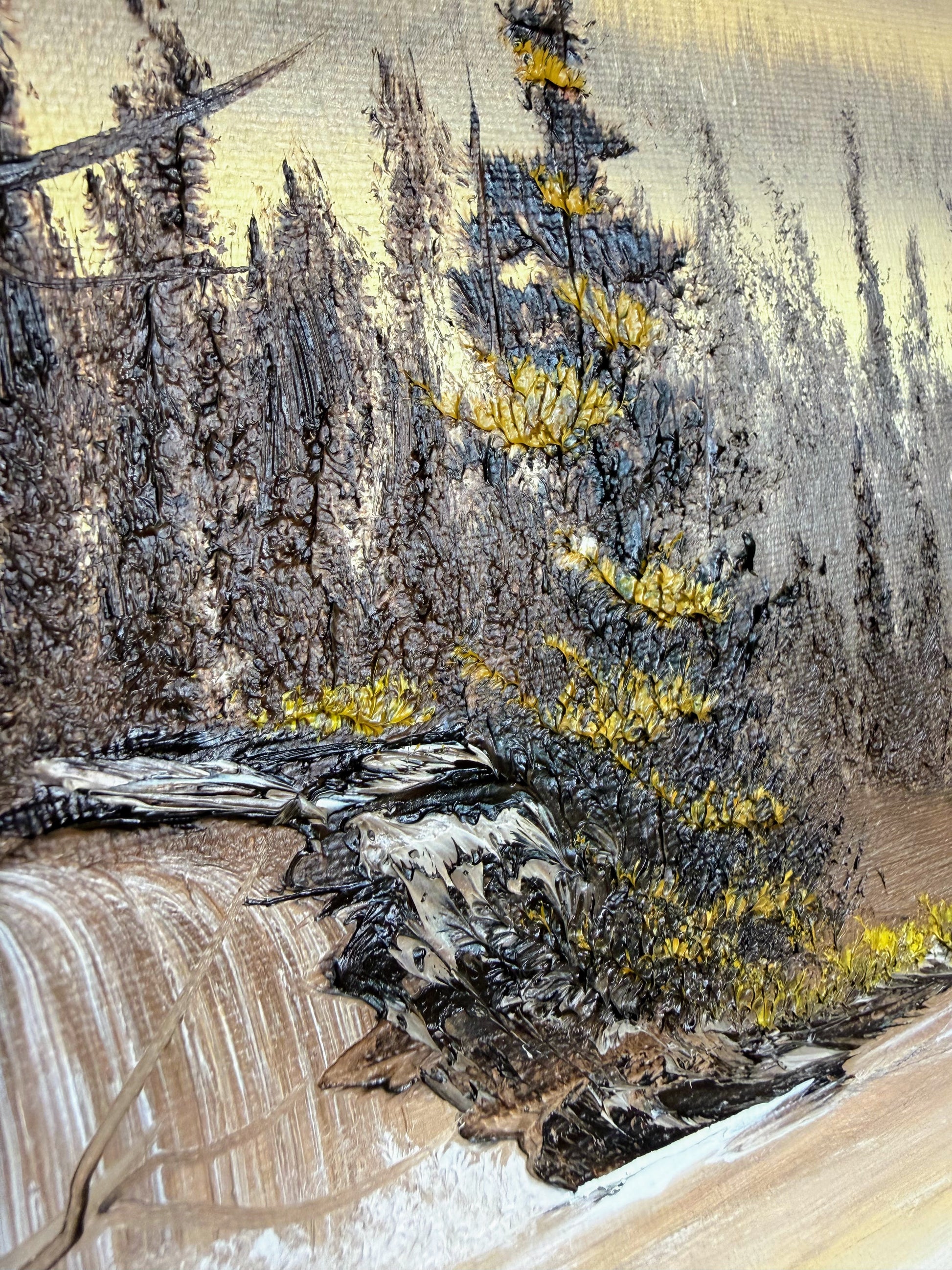Close-up of a textured surface with tree elements and waterfall.