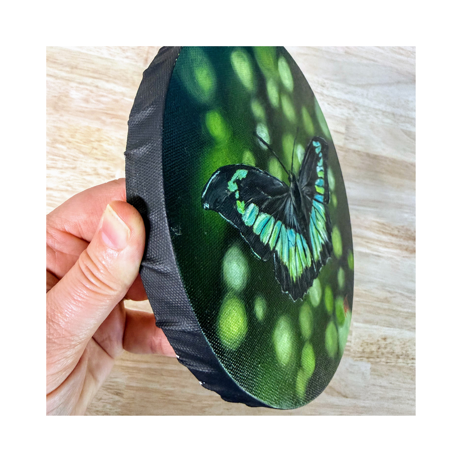 Jerry teal blue and green butterfly oil painting side view showing the black edge