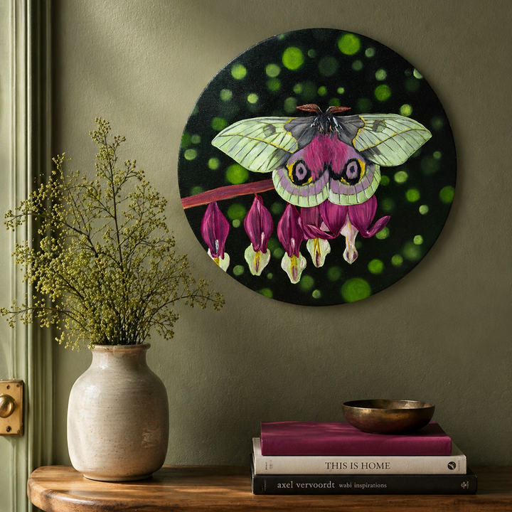Original oil painting of a white and pink moth sitting on pink bleeding hearts flowers on a 12" round canvas - displayed on sage wall