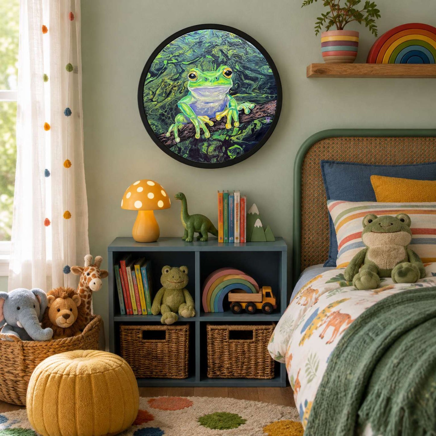 A styled children's bedroom featuring a round framed wall art of a green frog in a jungle. The room is decorated with a green headboard, colorful pillows, a yellow mushroom lamp, a blue storage shelf with books and toys, and a yellow pouf on the floor.