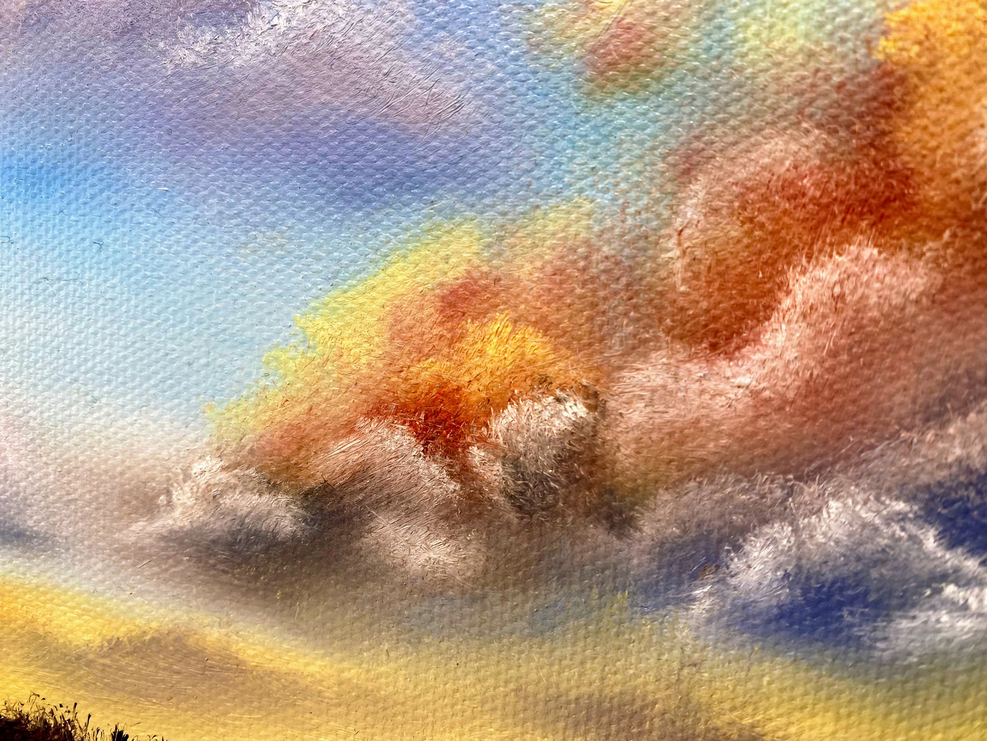 Colorful clouds in a blue sky with a textured art style