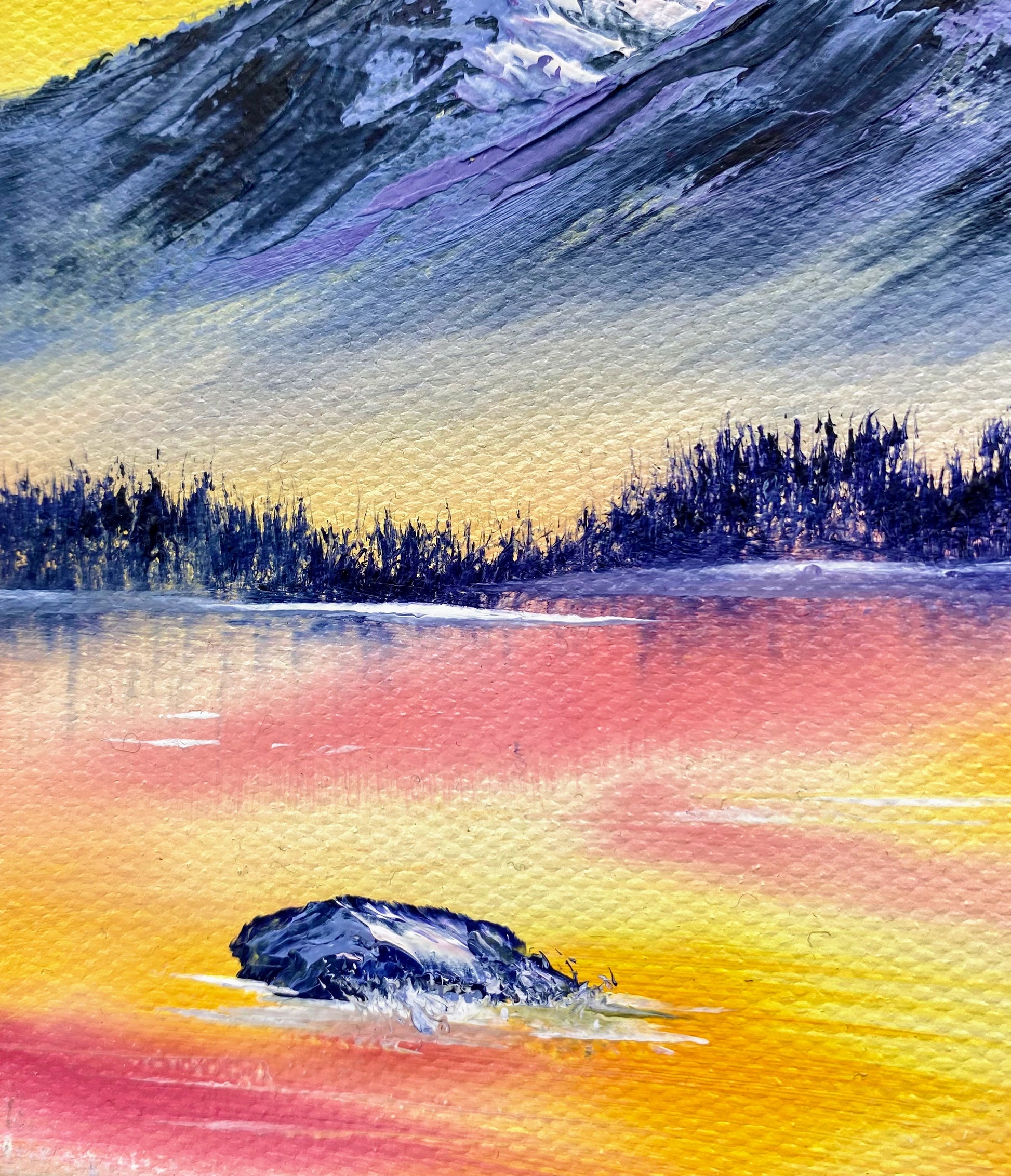 Colorful landscape with a mountain, lake, and rock formation.